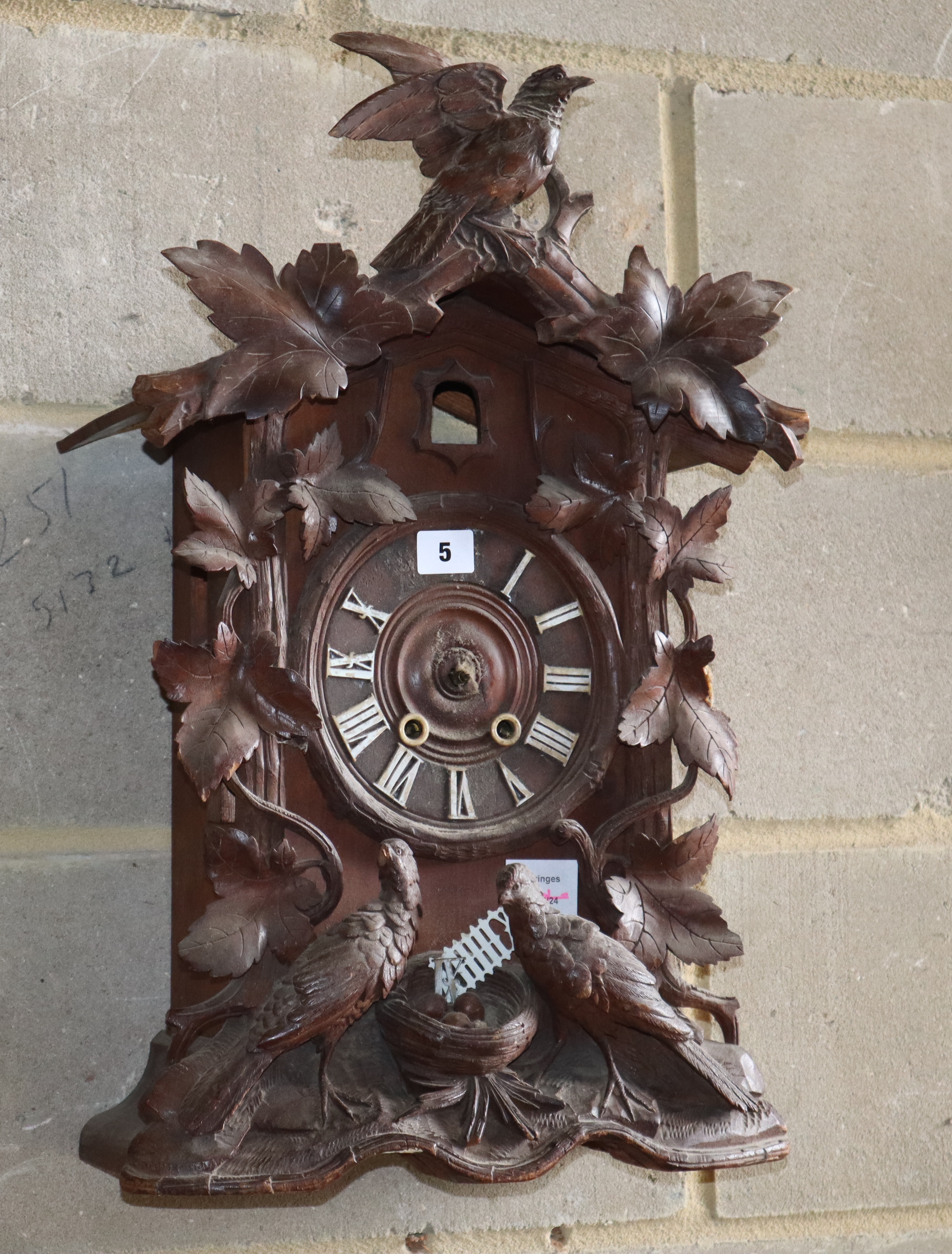 A late 19th century Black Forest cuckoo clock, lacking parts, W.36cm, D.18cm, H.57cm